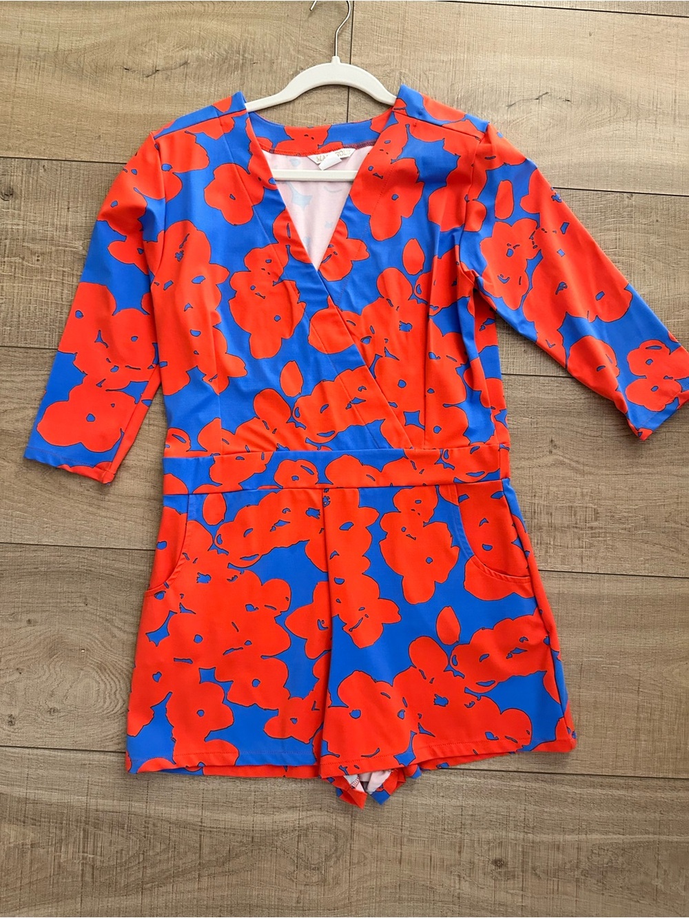 MAHI GOLD Blue and Bright Red Floral V-Neck Riptide Romper